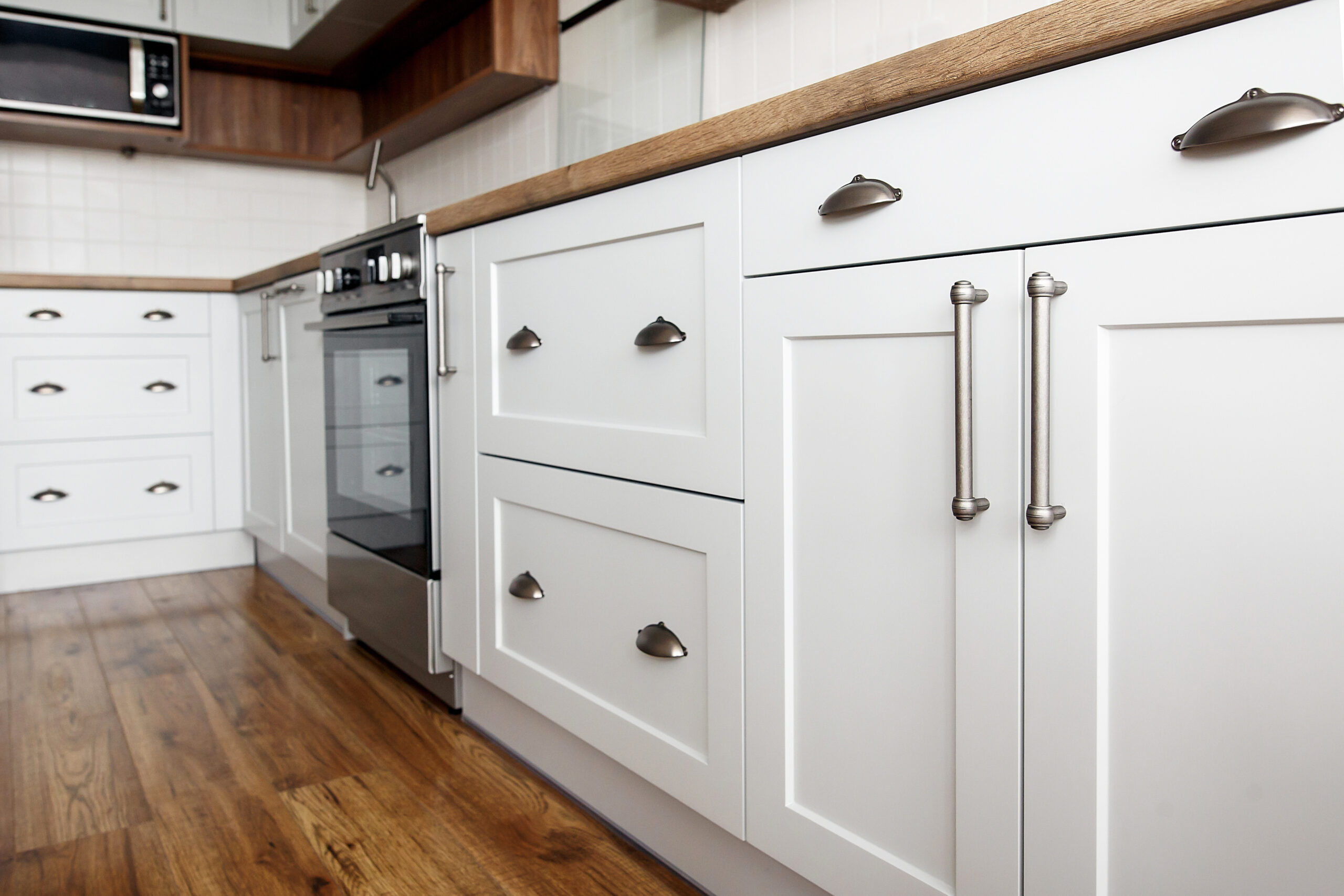 Stylish Light Gray Handles On Cabinets Close Up, Kitchen Interio